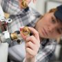 Home boiler with warning signs, highlighting common Leeds boiler problems and tips for spotting issues and finding reliable repair solutions