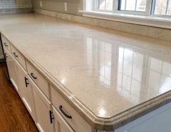 Painted laminate kitchen countertop makeover showing a smooth, modern finish in neutral tones, demonstrating an affordable DIY kitchen transformation