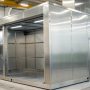 Powder coating booth with stainless steel construction, highlighting durability and long-term performance benefits.