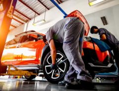 Mechanic performing regular garage maintenance as part of a subscription service in Canada
