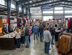 Homeowners browsing kitchen remodeling and flooring exhibitor booths inside the North Carolina State Fairgrounds Exposition Center during the Southern Ideal Home Show Fall 2026 in Raleigh