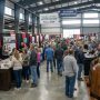 Homeowners browsing kitchen remodeling and flooring exhibitor booths inside the North Carolina State Fairgrounds Exposition Center during the Southern Ideal Home Show Fall 2026 in Raleigh