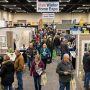 Homeowners browsing remodeling booths at a winter home show in Sandy, Utah