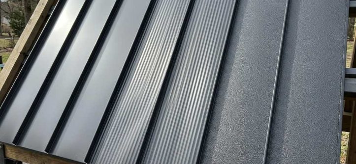 Striated metal roof panel showing shallow grooves along the pan