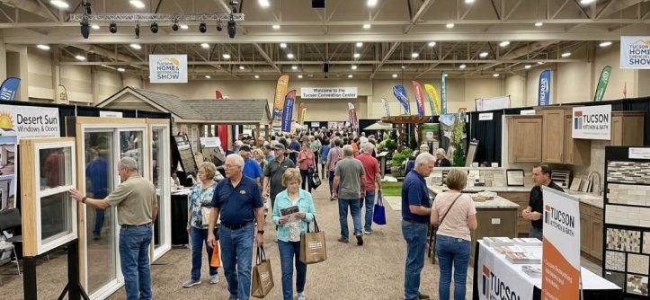 Visitors browsing remodeling booths inside the Tucson Convention Center exhibit hall