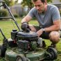 Homeowner loosening a lawn mower fuel cap to test a blocked vent