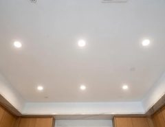 Recessed kitchen lighting layout with evenly spaced ceiling fixtures over countertops