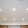 Recessed kitchen lighting layout with evenly spaced ceiling fixtures over countertops