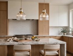 Two pendant lights hanging over a kitchen island at the correct height